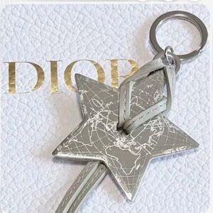 DIOR Silver Star Keychain with Map Design and Taupe Colored Leather.